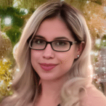 smiling woman with long blonde hair wearing dark-rimmed glasses